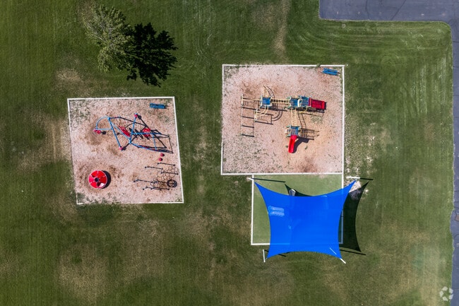 Three playgrounds with different playground equipment at Grant Elementary School.