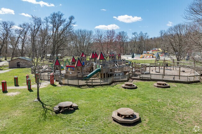 Coshocton Lake Park features a castle playground, pool, a lake with a large pavilion, and other amenities.