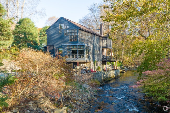 Along the stream in Silvermine sits a rustic barn house.