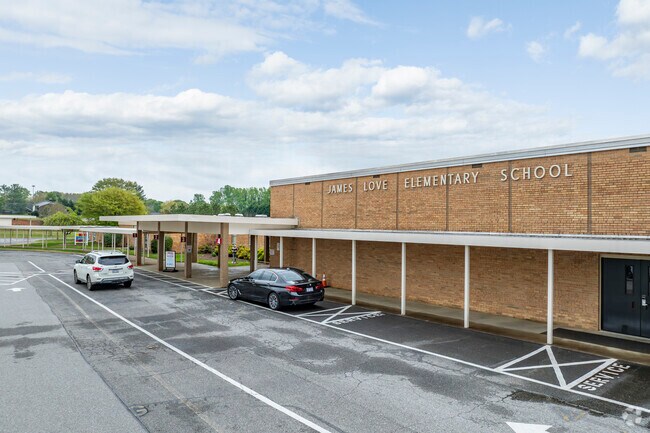 Student drop off and pick-up is well established and organized at James Love Elementary School.