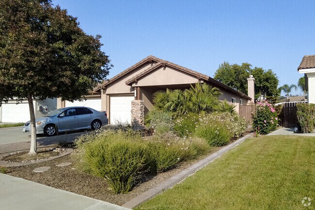 Manicured yards free of grass conserve water in South Pointe San Bernardino.