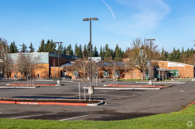 Large student and staff parking lot along side Hayes Freedom High School.