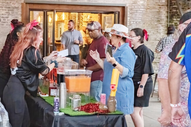 Drinks are all part of the party atmosphere at Touchdowns and Tunes in Downtown Albany.