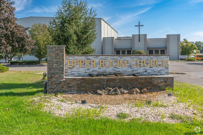 The school sign and fountain in front of Upper Room Christian School in Dix Hills.