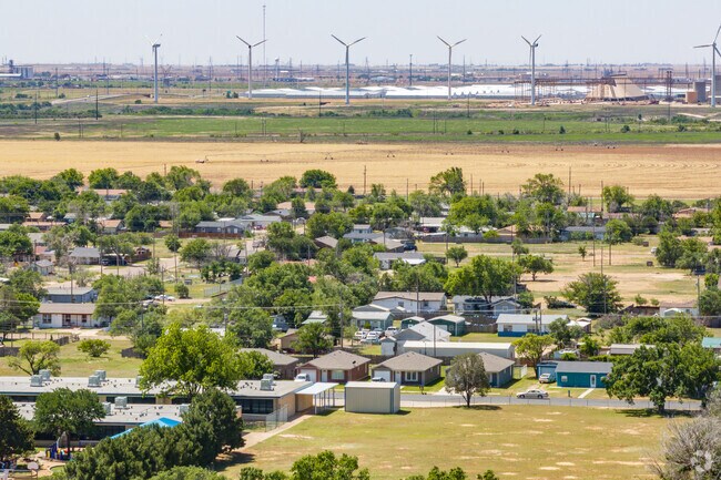 Windmill borders Lubbock's expansive farmlands and vital industries.