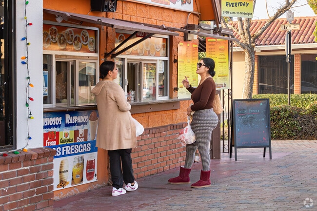 A couple of friends discuss the day while ordering lunch in Downtown Delano.