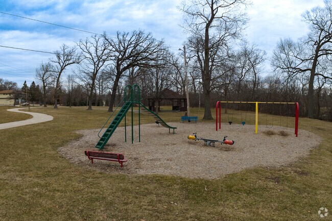 Residents enjoy the playground at Alford Park.