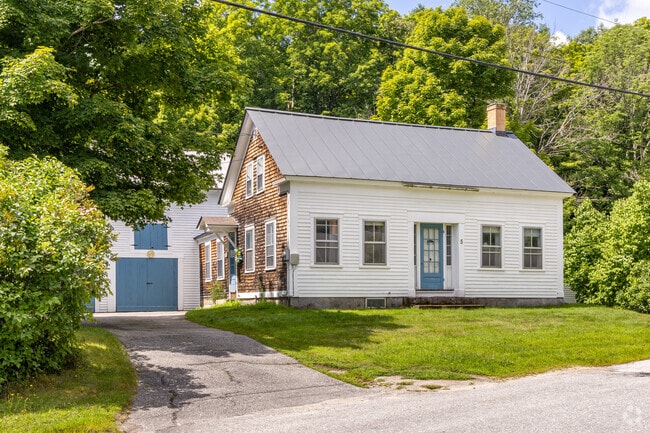 A Colonial-inspired home typical of those near the Sutton, NH town center.