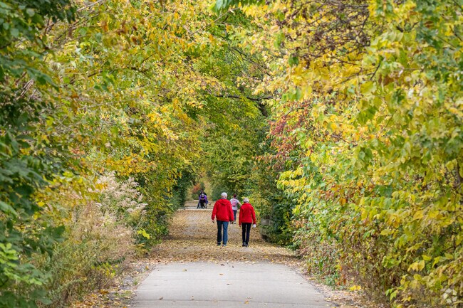 Matching sweaters stand out among the tress on Constitution Trail in Normal, IL.