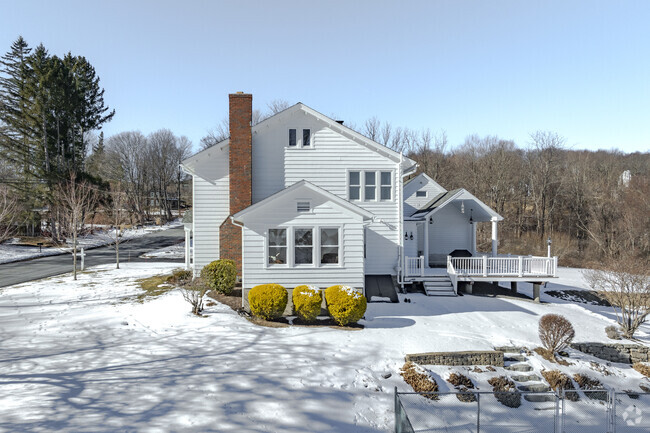 This Torrington colonial has a corner lot with ample space and a pool only a few blocks from Main Street.