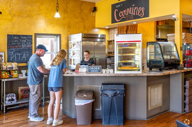 Carmine's Pizzeria serves big slices and is a favorite among locals.