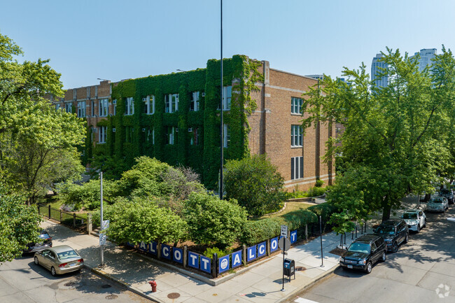 Aerial corner view with ivy covered wall of Alcott College Prep East Campus, Chicago Illinois.