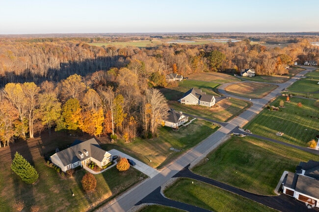 Enjoy the evenings in Highland Home surrounded by a scenic landscape bathed in sunlight.