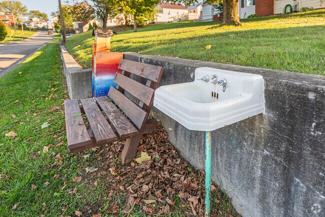 A sink sits on a street corner across from a local park in First Ward.