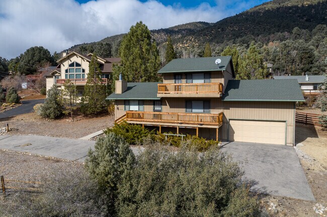 San Emigdio Mountain provides a majestic backdrop to a row of spacious cabins in Pine Mountain.