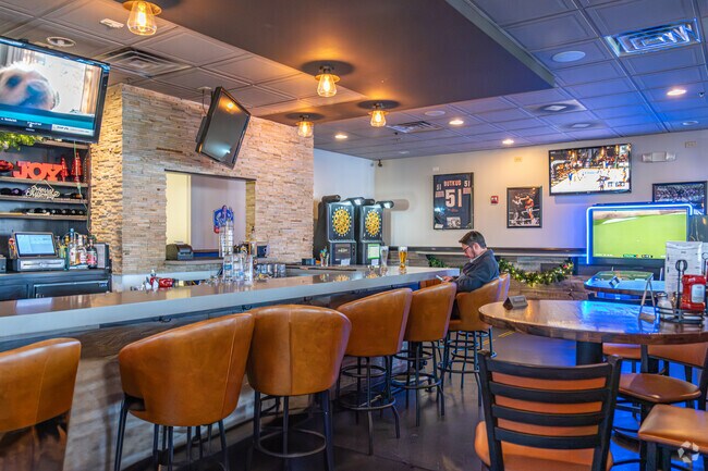 Residents love watching their favorite sports team at Bottom's Up Sports Bar & Grill.