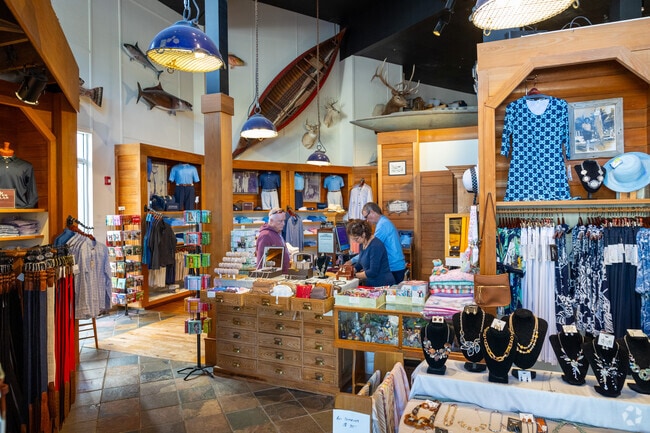 Fine retailers at The Village Shops on Venetian Bay are located just north of Coquina Sands.