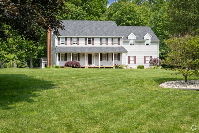 The Ashford neighborhood is recognized for its large colonial homes featuring spacious yards and scenic greenery.