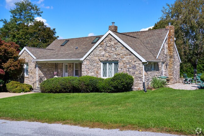 You can find a charming stone construction cottage style home in Highfield-Cascade.