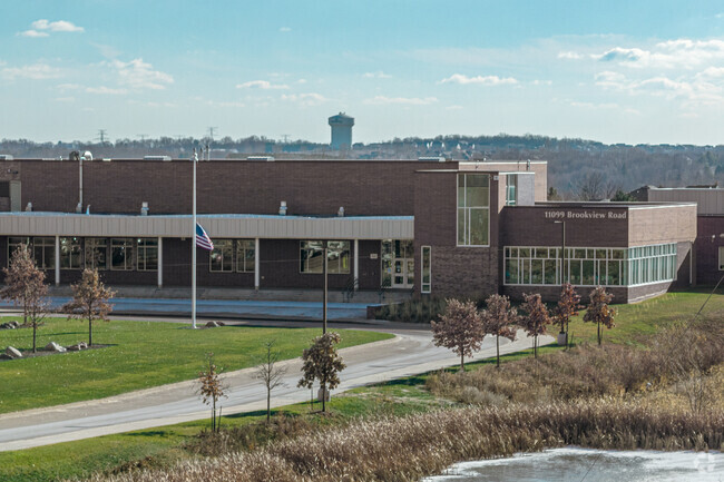 Trees line the entry to Brookview Elementary.