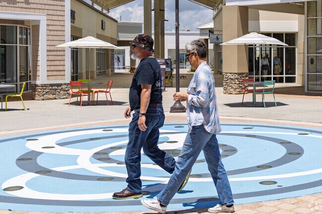 Strolling through the splash pad area near Arcadian Shores at Tanger Outlets Myrtle Beach.