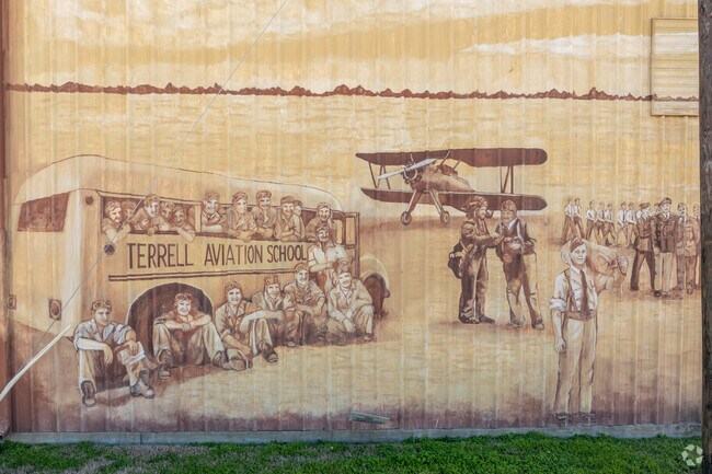 The Terrell Aviation School mural depicts its first flight class in Terrell.