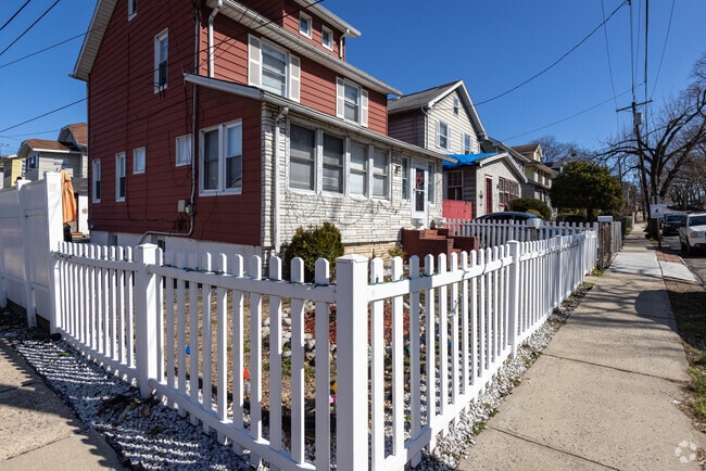 A white picket fence adds to the neighborhood homey feel in Irvington, NJ.