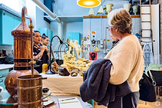 An artist demonstrates her creative process during the Open Casket art event.