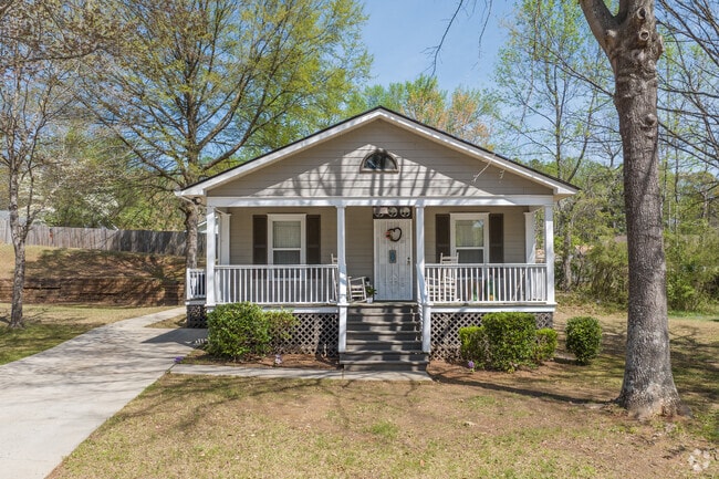 Many houses sit back on wooded lots surrounded by tall shade trees.