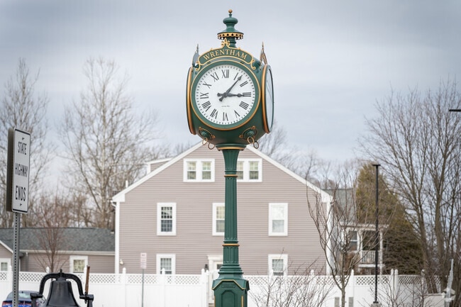 Discover a stunning street lamp clock with Wrentham’s name in West Wrentham, MA.