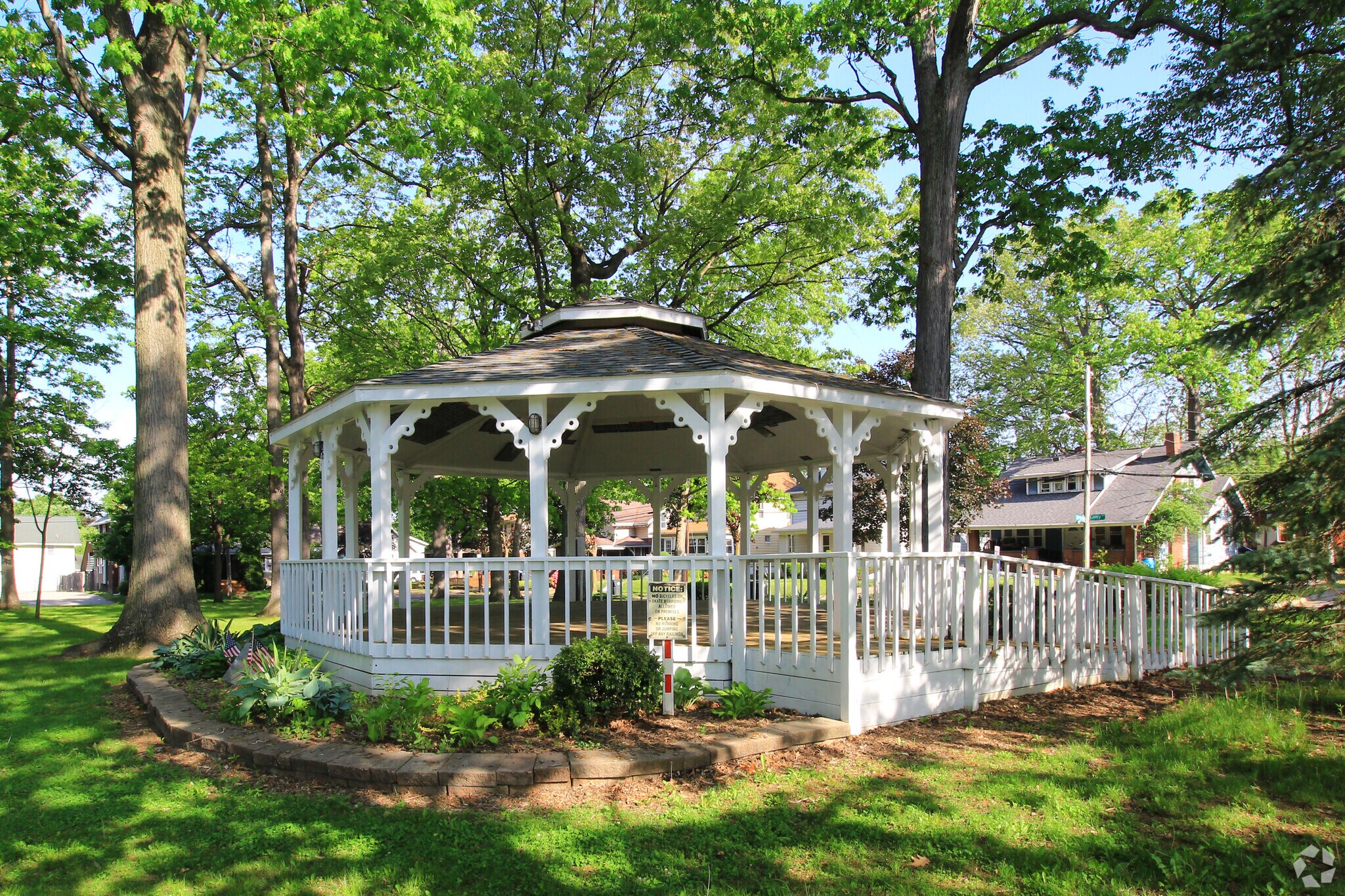 A white gazebo provides shade in Shadyside Park in the Kenmore neighborhood of Akron.