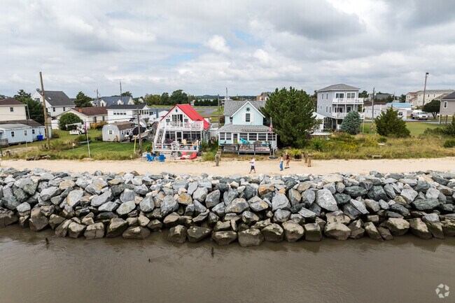 Colorful beach-style homes line the river banks.
