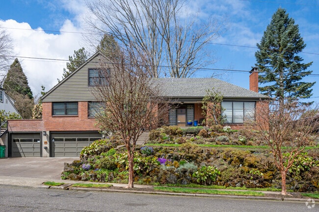 Mid-century modern home with lush sloped landscaping in the South Burlingame neighborhood.