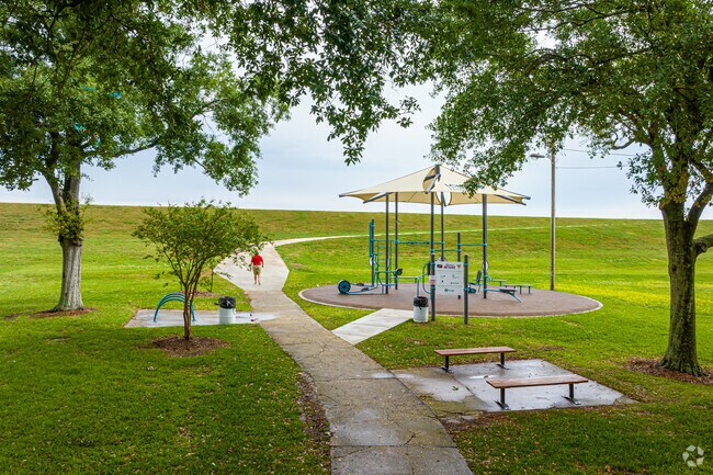 The shaded Clearview Shores FitLot Fitness Park offers free fitness classes led by certified fitness professionals