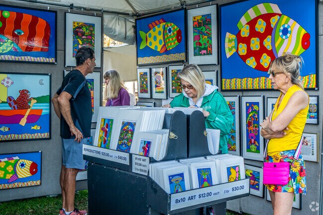 The St. Petersburg Fine Art Festival has a open booths for you to purchase artwork for your home.