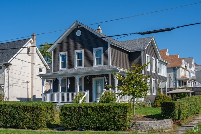 Clean cut hedges and landscaping outline this updated farmhouse in Dunmore.