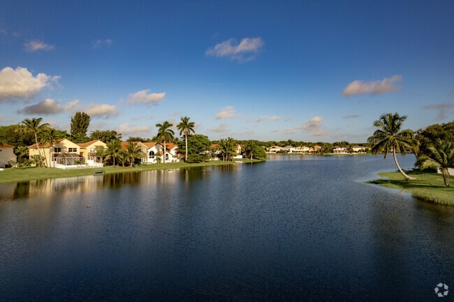 Life in the Lake Charleston neighborhood of Green Acres, FL is a tropical paradise.