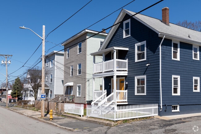 Houses with decks and triple deckers are well-kept in the Oak Hill neighborhood.