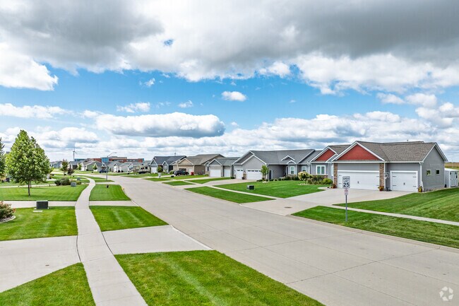 New developments and streets lined with contemporary builds become common as you move out through Huxley.