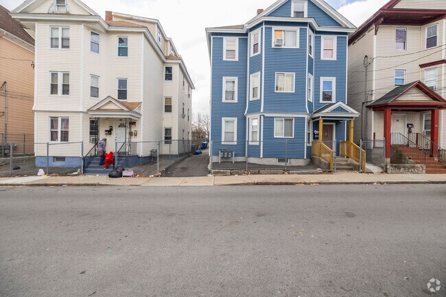 Iconic triple-decker homes in Lawrence, reflecting the city's rich history.