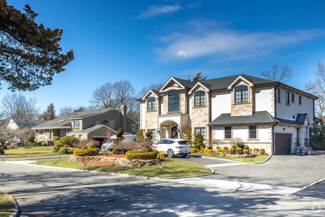 Many residents of Hewlett Harbor have replaced original homes with larger colonial versions.