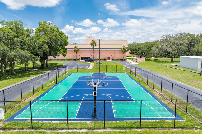 Students enjoy outdoor play on the sports courts at First Christian Academy.
