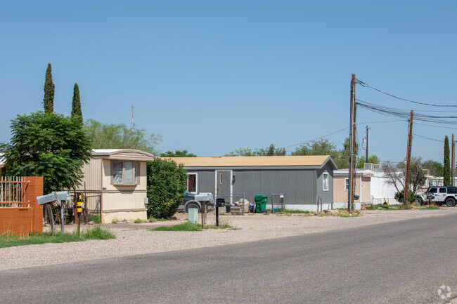 A row of traditional manufactured homes in Los Ranchitos.