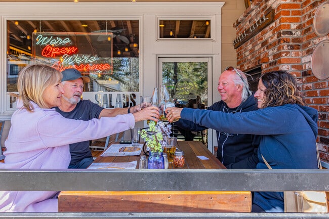 Eat on the patio at Saucy Mama's Pizzeria in Big Bear Lake with friends and enjoy the outdoors.