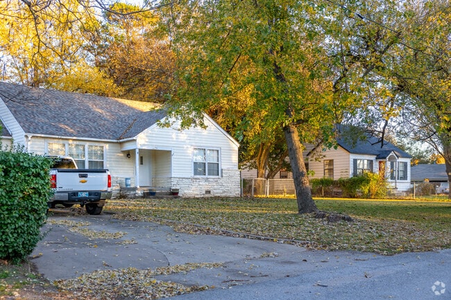 Coweta locals enjoy the natural beauty  of mature trees just steps from their homes.
