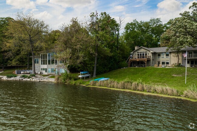 A row of homes with differing architectural styles in Tower Lake Park.