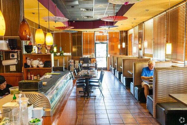 The inviting interior of Sushi Bar Grill creates the perfect atmosphere for dining.