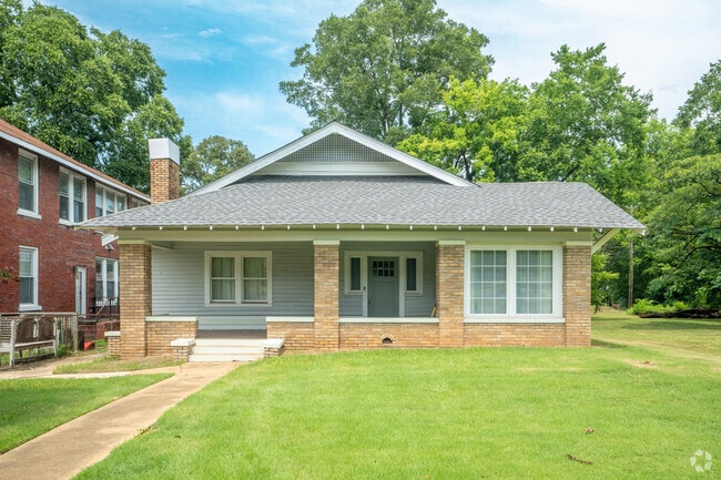 Take a break from the heat under the shade of this Craftsman style home's front porch.