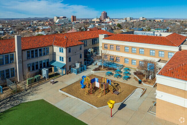 Pictured is Eugene Field Elementary School's playground and downtown Albuquerque.