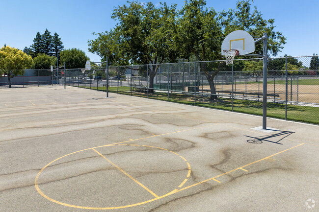 Students learn teamwork by playing basketball at Clovis Elementary School.
